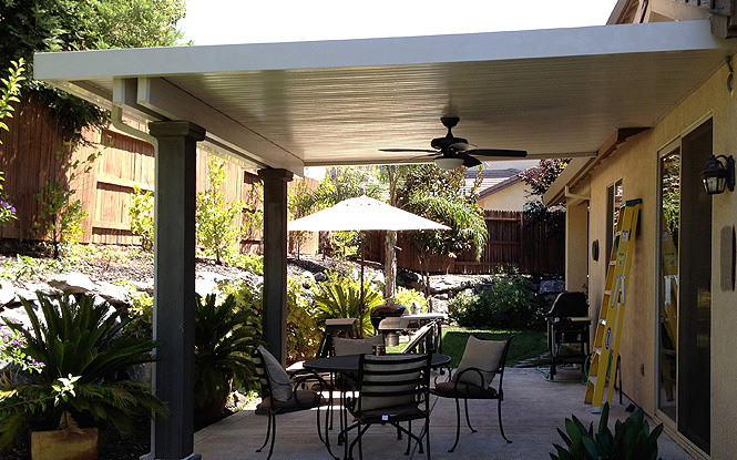 Creating an intimate outdoor space with a covered patio and bistro set.