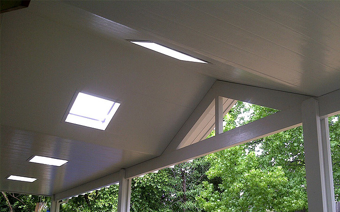 Tranquil porch bathed in natural light from a skylight above.